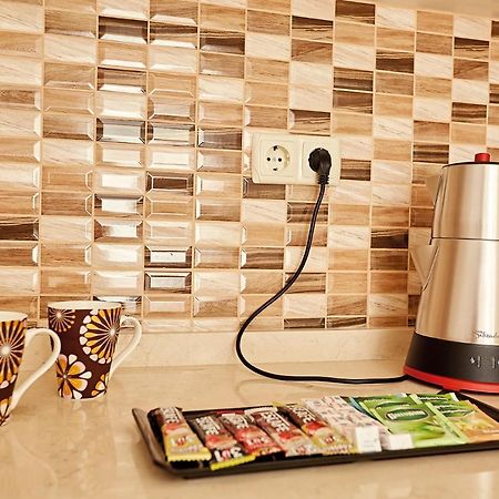 Bursa Suites Apart Otel Eksteriør billede A kettle plugged into a wall socket